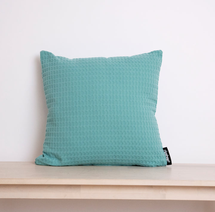 Housse de coussin gaufré 100% coton turquoise