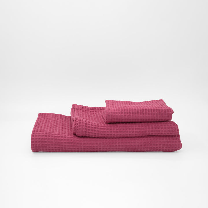 Serviette gaufrée 100% coton fuchsia
