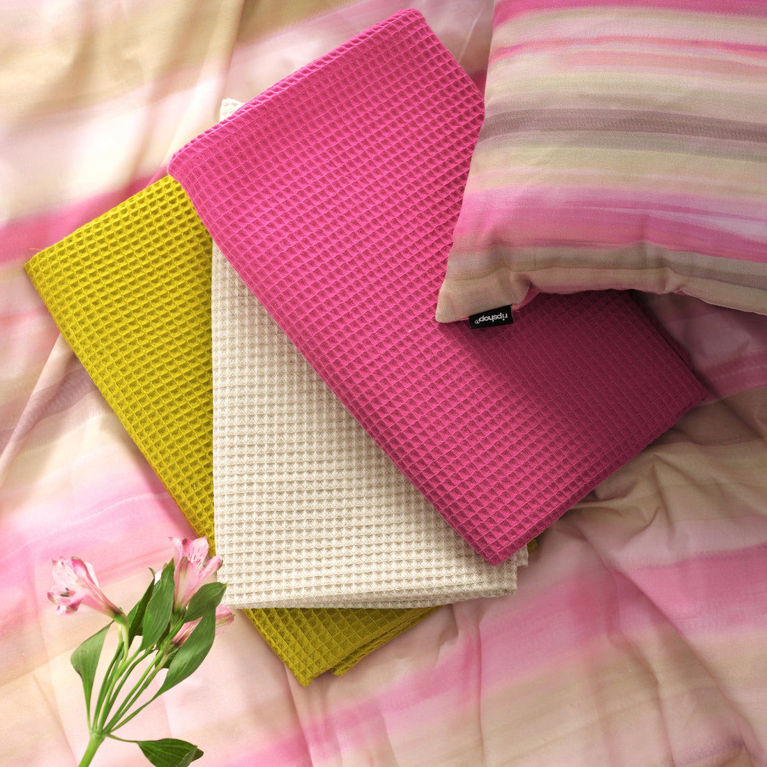 Serviette gaufrée 100% coton fuchsia
