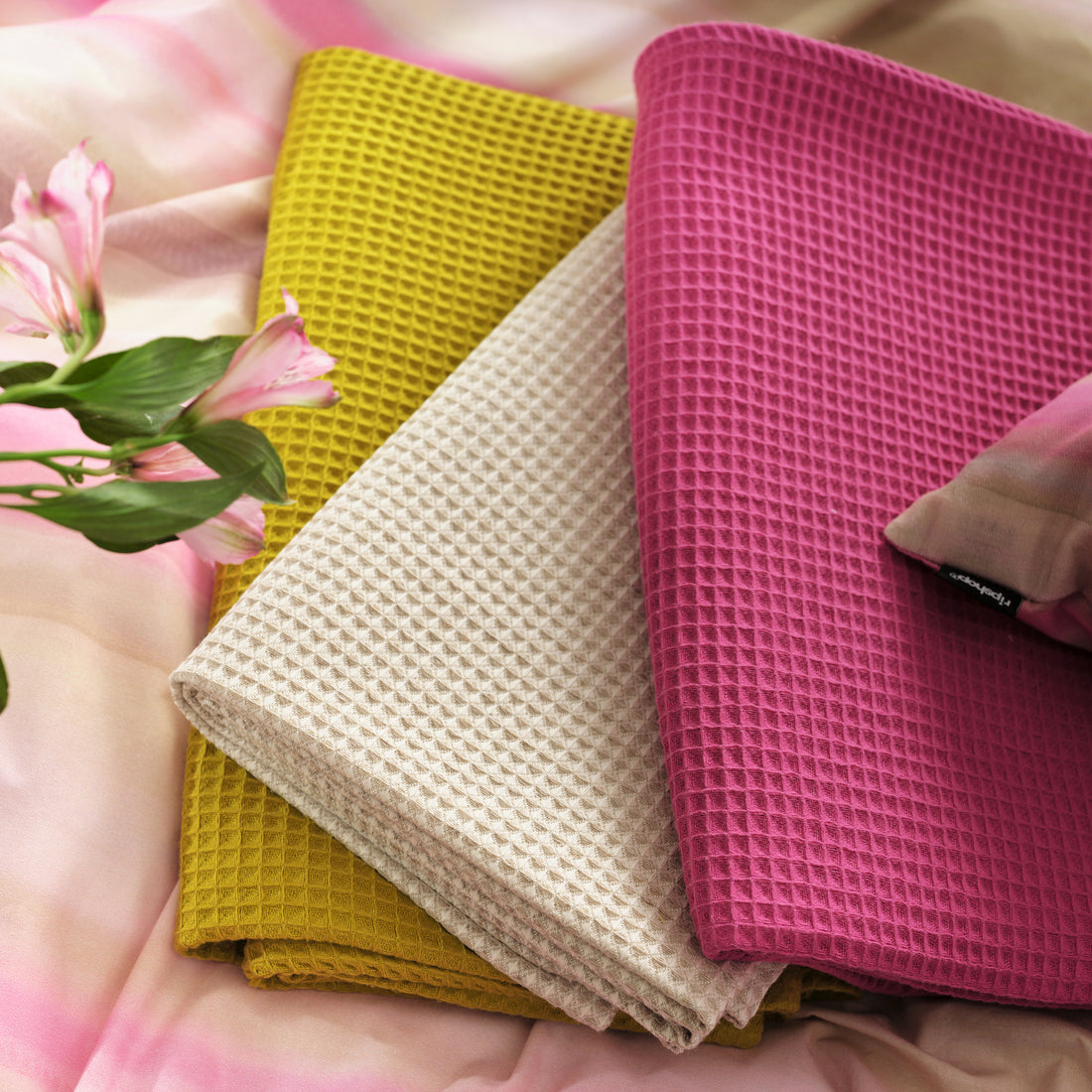 Serviette gaufrée 100% coton fuchsia