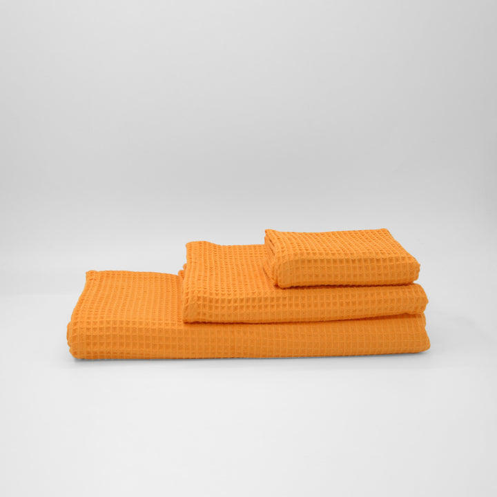 Serviette gaufrée 100 % coton orange clair