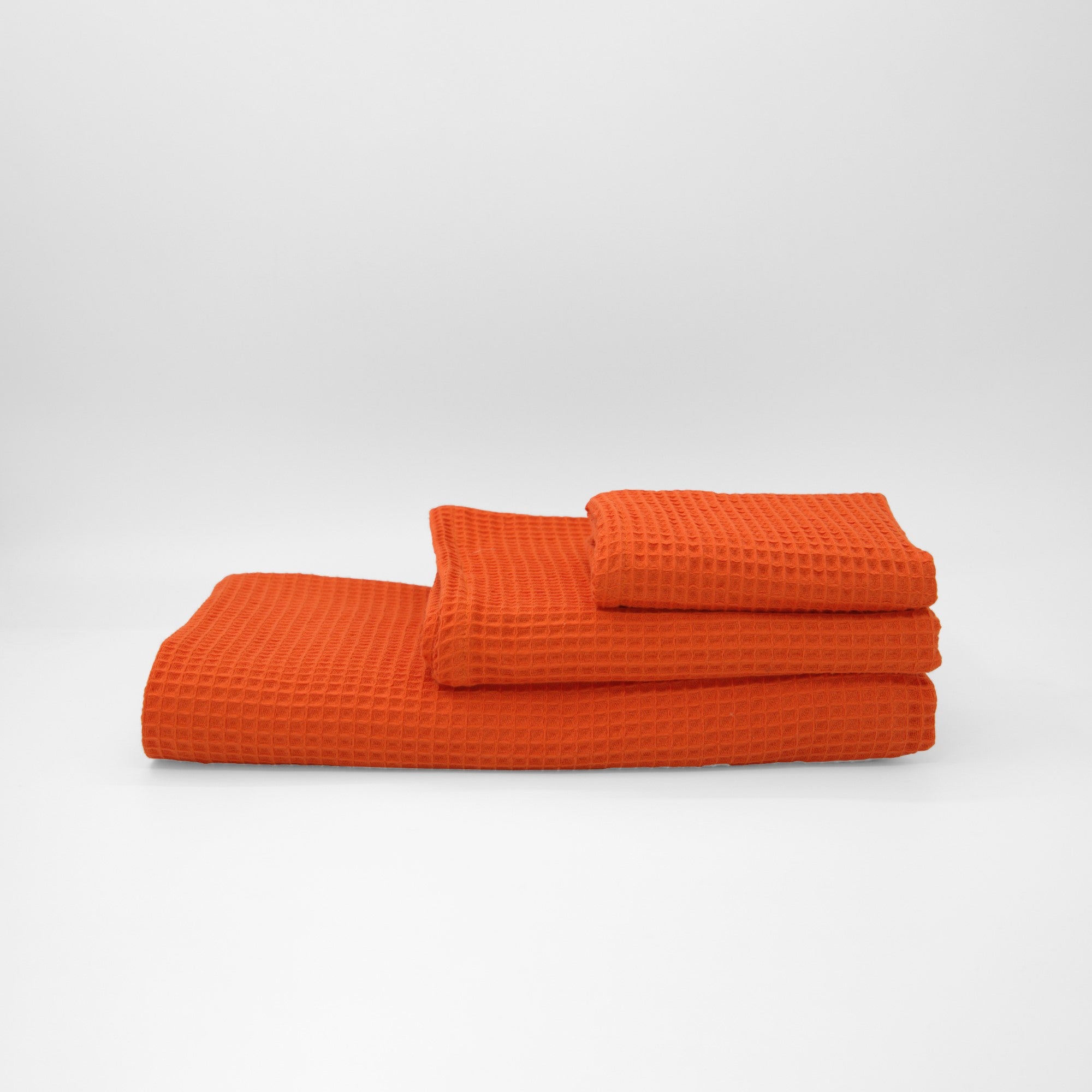 Serviette gaufrée 100 % coton orange foncé