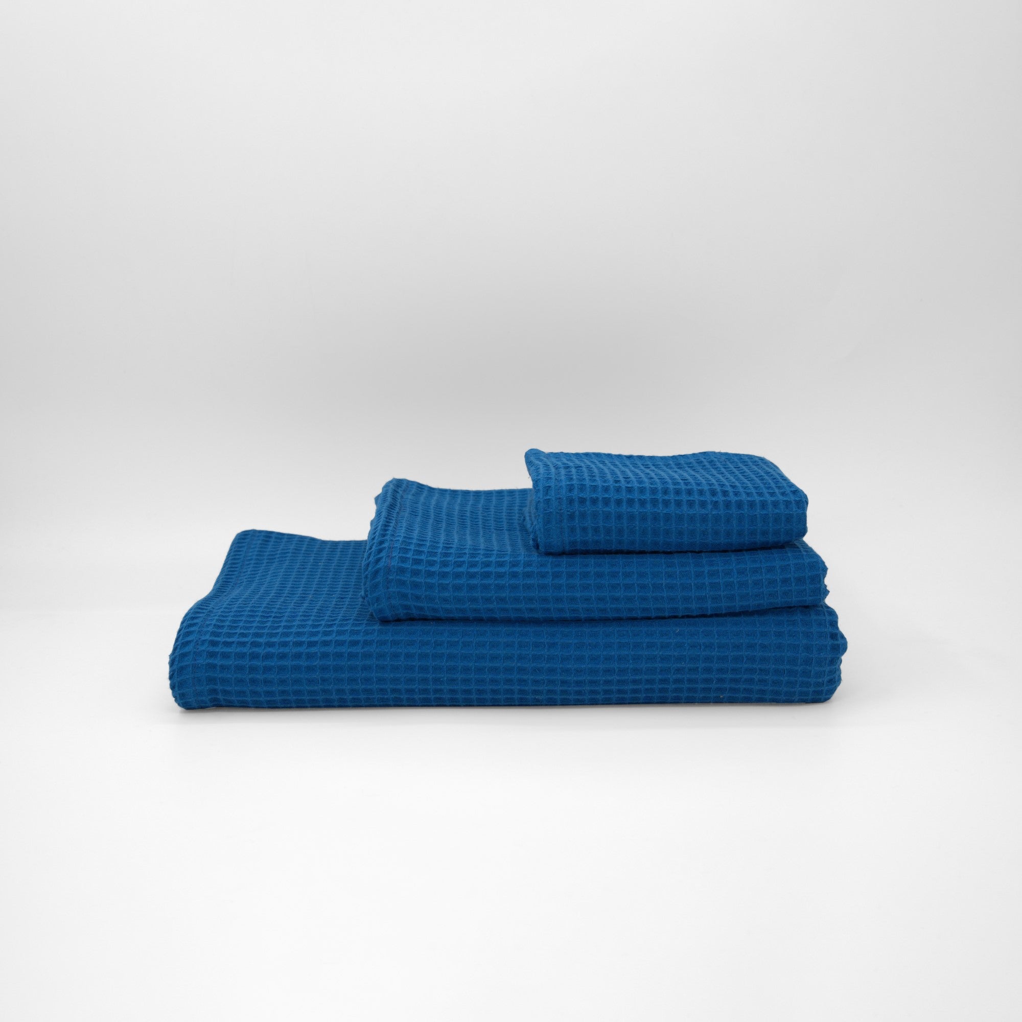Serviette gaufrée 100% coton bleu cobalt
